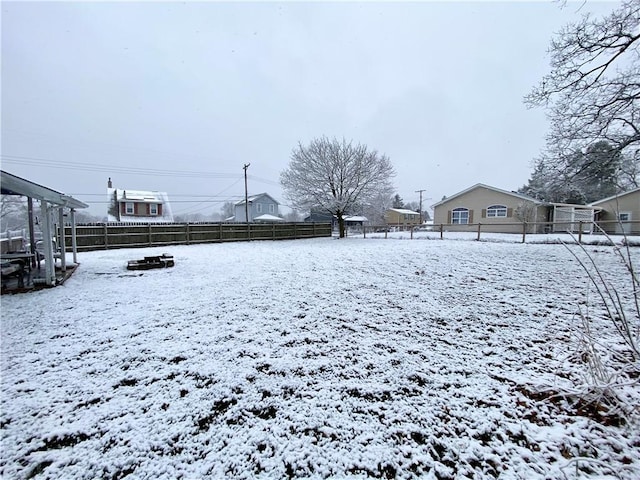 view of yard layered in snow