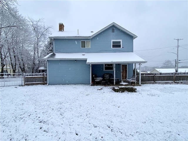 view of snow covered house