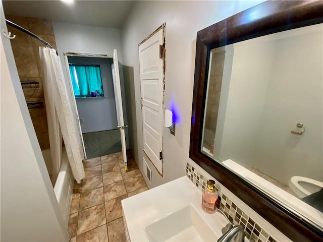 bathroom featuring tile patterned floors and shower / tub combo with curtain