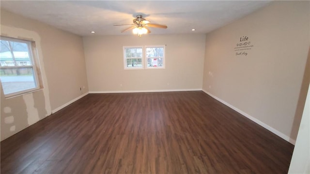 unfurnished room featuring ceiling fan and dark hardwood / wood-style floors