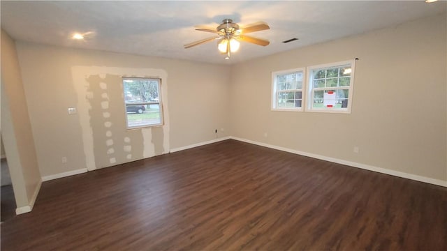 unfurnished room featuring ceiling fan and dark hardwood / wood-style flooring