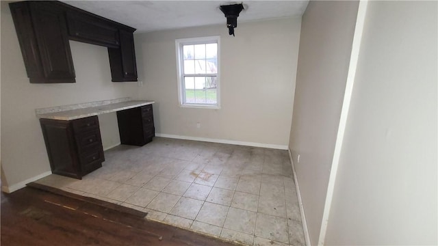 unfurnished dining area with built in desk