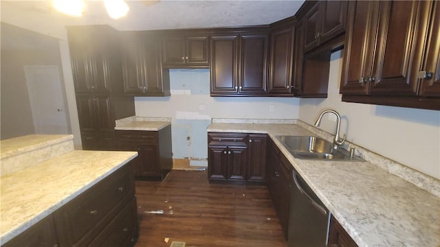 kitchen with dark brown cabinetry, light stone countertops, sink, stainless steel dishwasher, and dark hardwood / wood-style floors