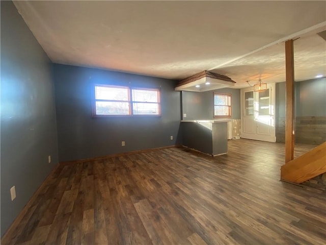 spare room featuring dark hardwood / wood-style flooring