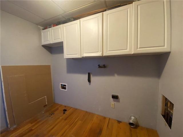 laundry area with cabinets, washer hookup, hardwood / wood-style flooring, and electric dryer hookup