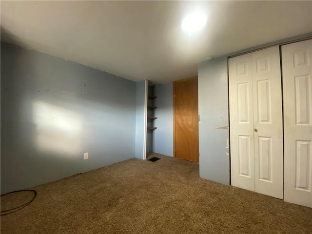 unfurnished bedroom with carpet floors