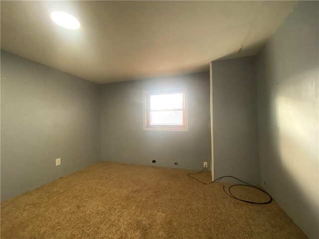 unfurnished room featuring carpet flooring