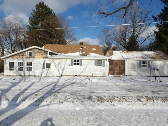 view of snow covered property