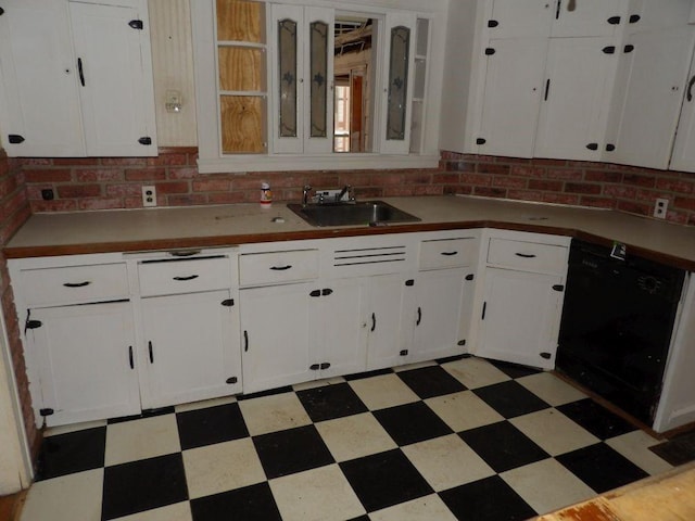 kitchen with backsplash, dishwasher, white cabinetry, and sink