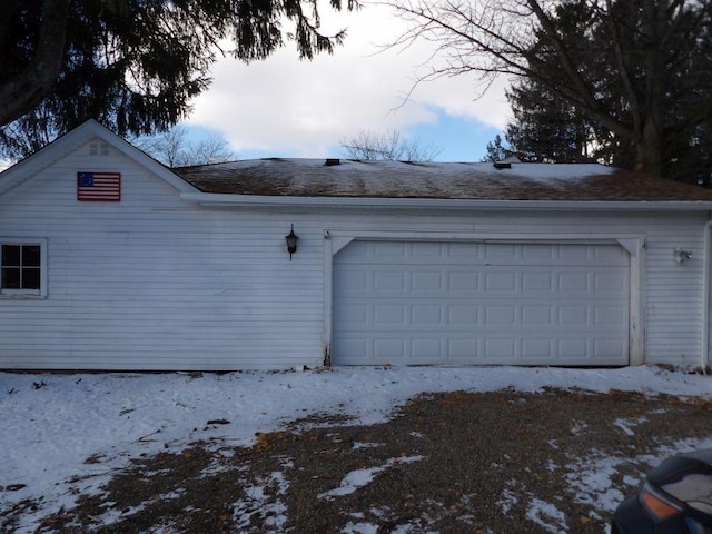 view of snow covered garage