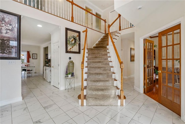 stairs featuring french doors