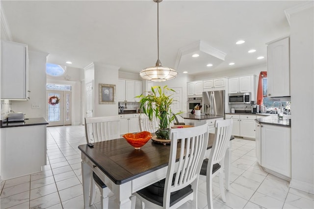 dining area with crown molding