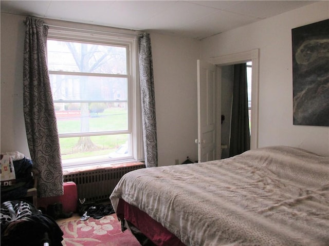 bedroom with radiator heating unit