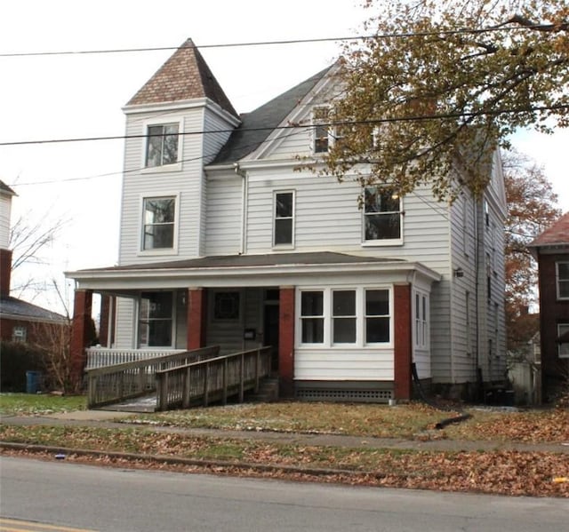 victorian house featuring a porch