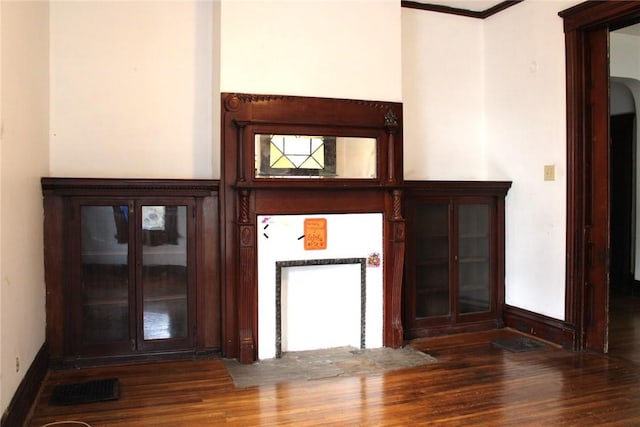 interior details featuring hardwood / wood-style floors and ornamental molding