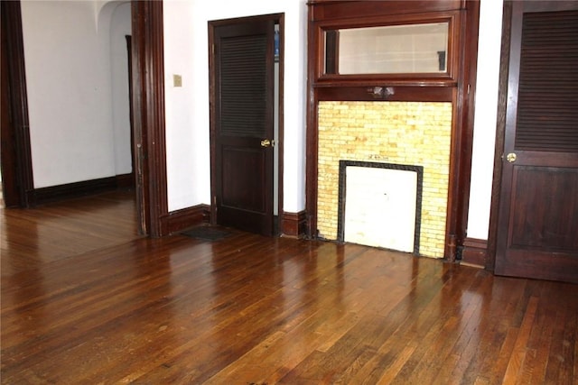 unfurnished room with dark hardwood / wood-style floors