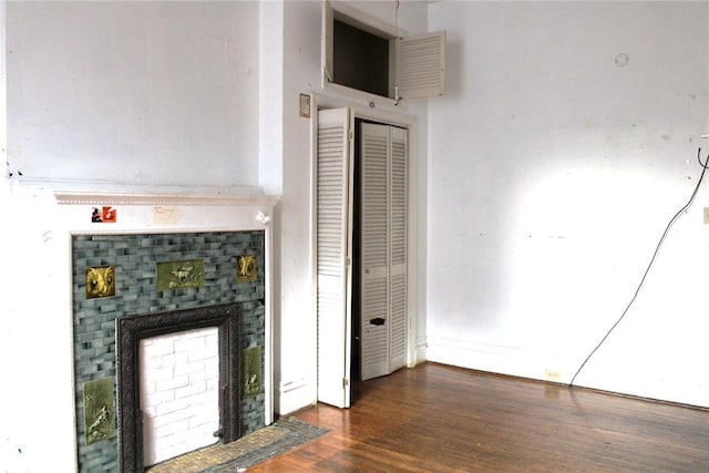 interior space featuring a fireplace and dark hardwood / wood-style flooring