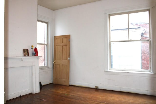 spare room featuring dark hardwood / wood-style floors