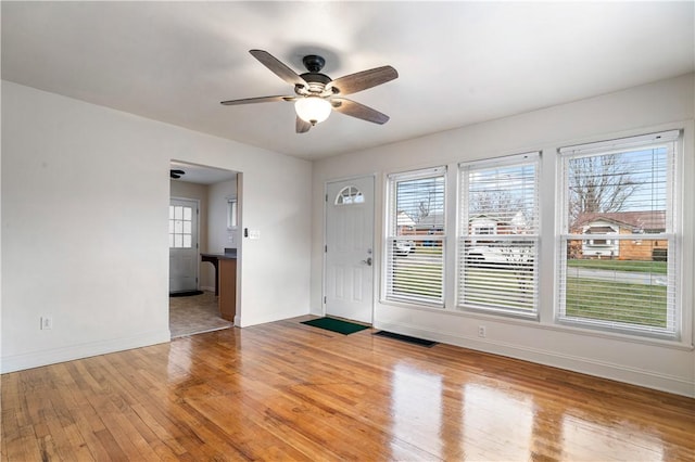 entrance foyer featuring ceiling fan and light wood-type flooring