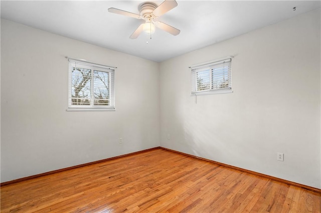 unfurnished room featuring light wood-type flooring and ceiling fan