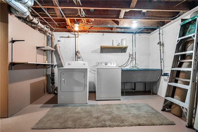 laundry room with independent washer and dryer and sink