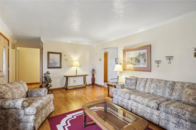 living room with light hardwood / wood-style flooring and ornamental molding