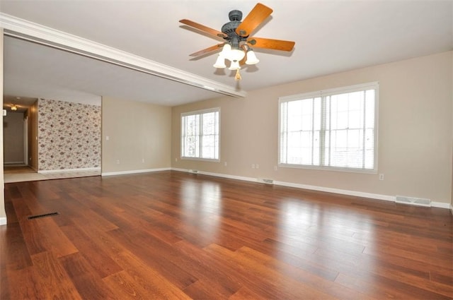 unfurnished room featuring ceiling fan and dark hardwood / wood-style flooring