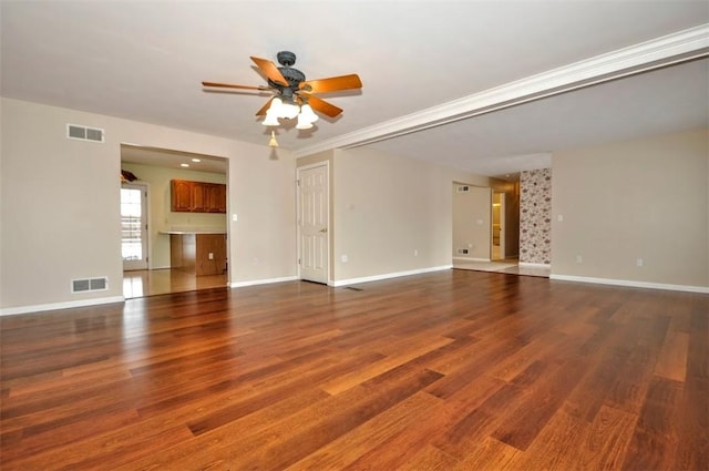 unfurnished living room featuring ceiling fan and hardwood / wood-style flooring