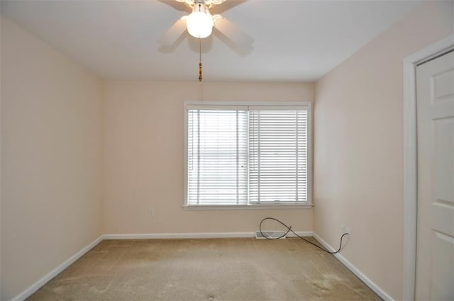 carpeted empty room with ceiling fan