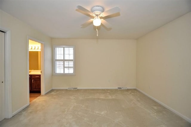 interior space with ceiling fan