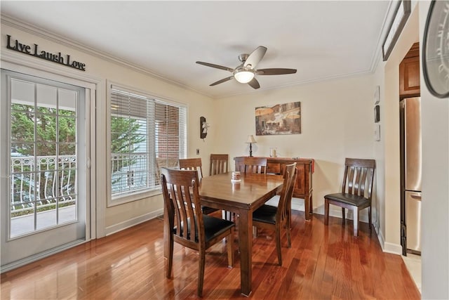 dining area featuring hardwood / wood-style floors, ceiling fan, and ornamental molding