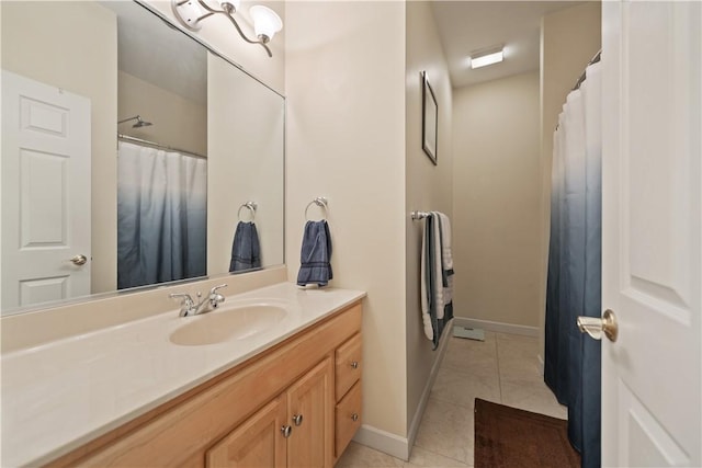 bathroom featuring tile patterned flooring and vanity