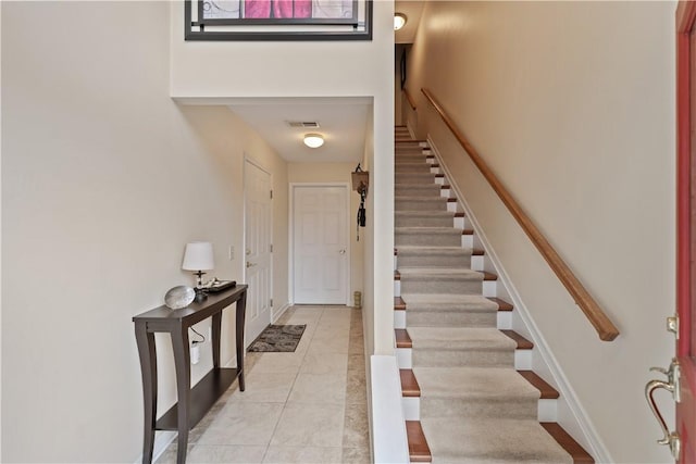 foyer entrance featuring light tile patterned floors