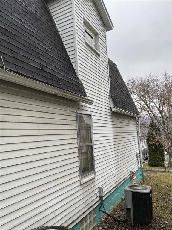 view of property exterior with central AC unit