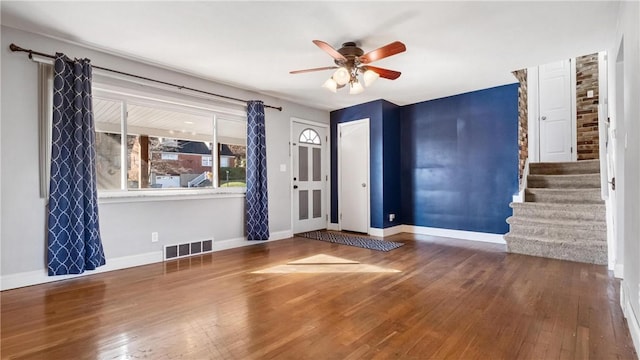 foyer entrance featuring hardwood / wood-style floors and ceiling fan