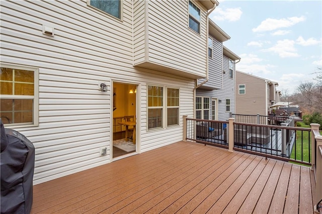 wooden terrace with a grill