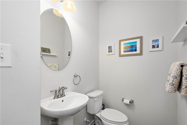 bathroom with toilet and sink