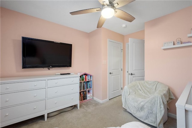 living area featuring ceiling fan and light colored carpet