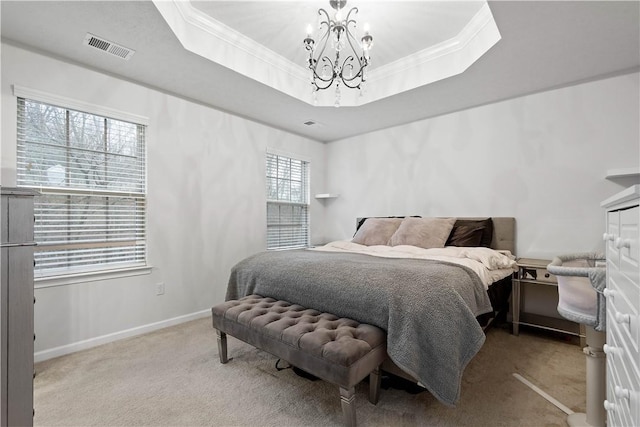 carpeted bedroom featuring a raised ceiling, crown molding, and an inviting chandelier