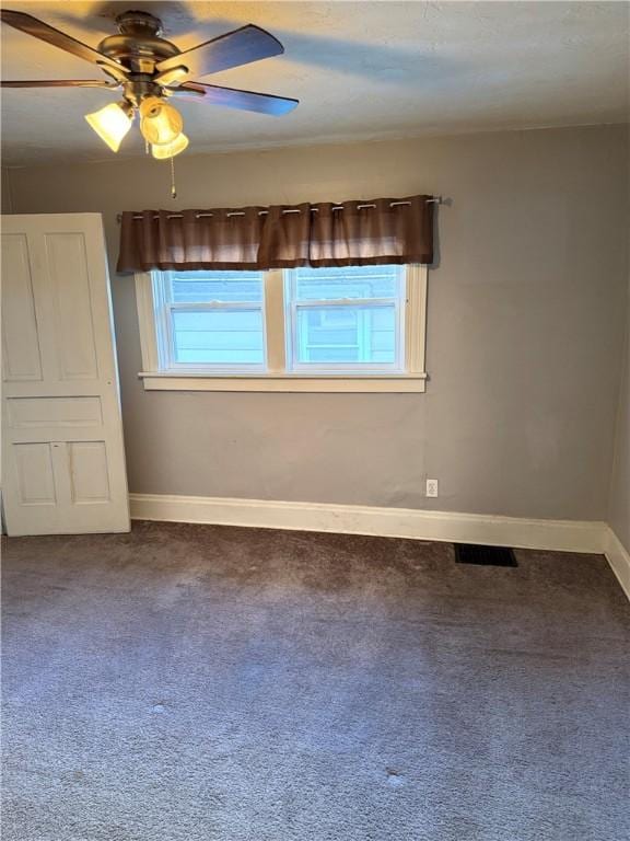 unfurnished room featuring carpet flooring, ceiling fan, and plenty of natural light