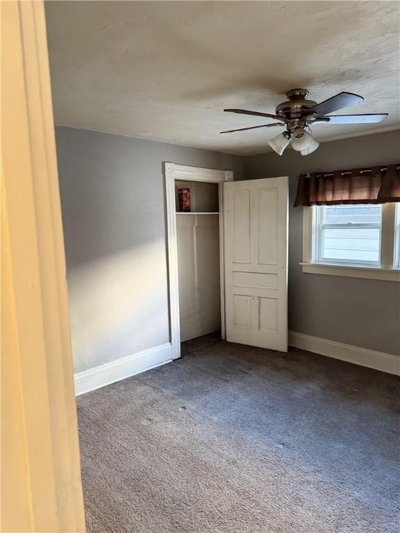 unfurnished bedroom with carpet floors, a closet, and ceiling fan