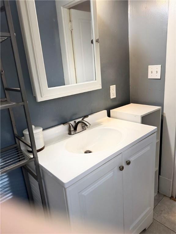 bathroom with tile patterned flooring and vanity