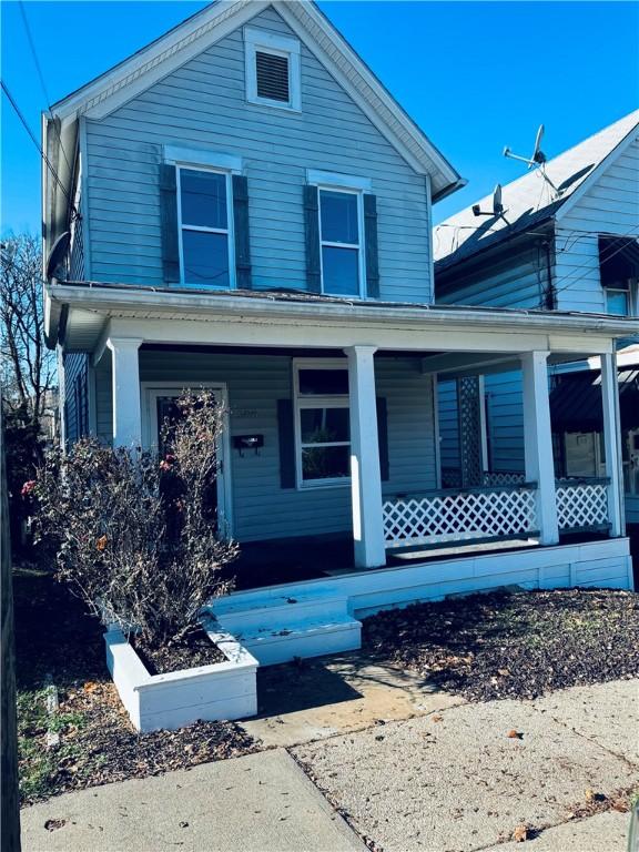 view of property with covered porch