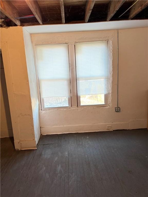 spare room with dark hardwood / wood-style flooring