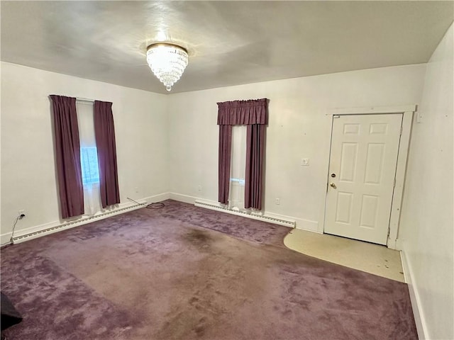 carpeted spare room with a baseboard radiator and a notable chandelier