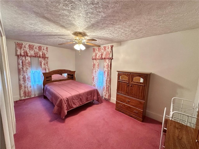 bedroom with carpet flooring, ceiling fan, and a textured ceiling