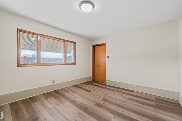 empty room featuring light hardwood / wood-style floors