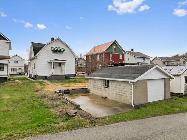 exterior space featuring a garage and a yard