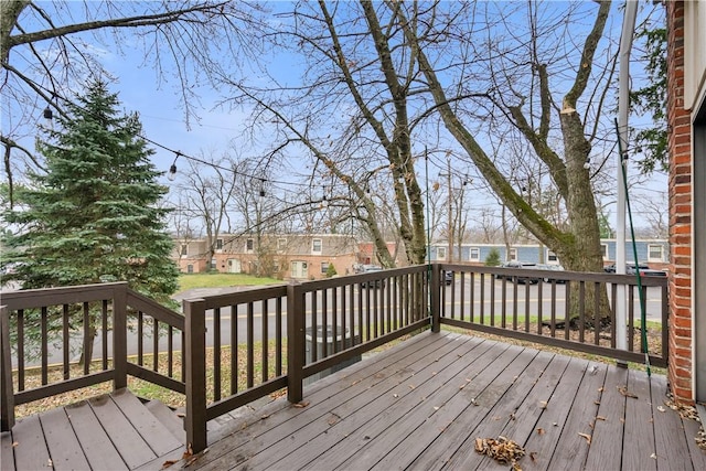 wooden deck featuring a residential view