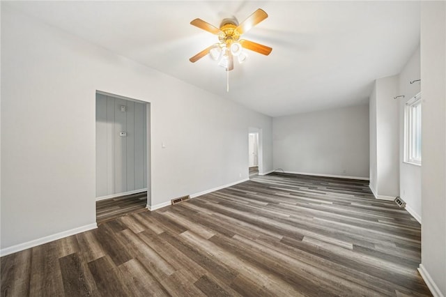 spare room featuring ceiling fan and dark hardwood / wood-style floors